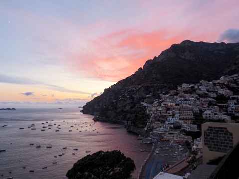 An aerial view of the beautiful shore of Positano on the Amalfi Coast in Italy at sunset