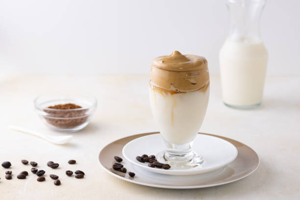 istock Soft focus of dalgona coffee topped with chocolate chips and a cinnamon stick 1440543142