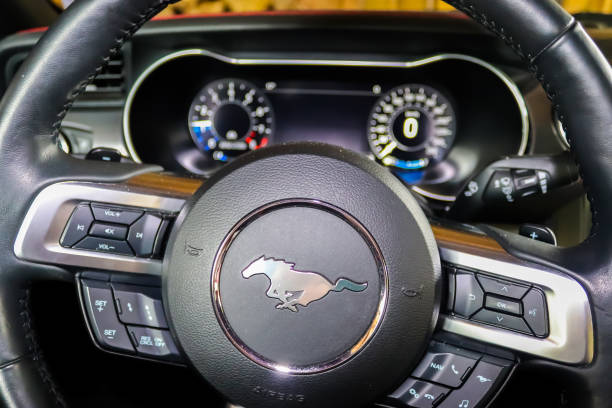 Kiel, Germany – November 14, 2020: View into the cockpit at the instruments of a Ford Mustang Model 2018 - muscle car USA