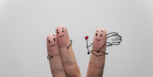 A closeup shot of finger couple in love, with cupid finger aside