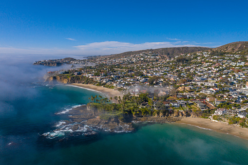 Laguna Beach, California, United States – November 17, 2020: An aerial photograph of Twin Points Estates, jutting out into the Pacific Ocean between Crescent Bay Beach and Shaws Cove.