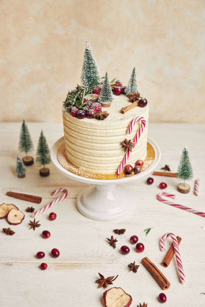istock Vertical shot of a white cake with Christmas decorations 1440547571