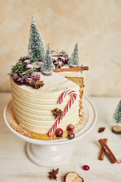 istock Vertical closeup of a Christmas cake missing one slice 1440547623