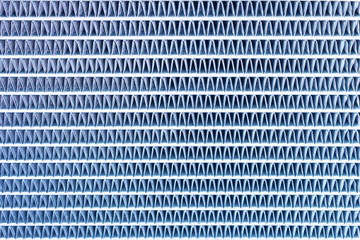 Close up of air conditioning condenser, Blue color abstract background.