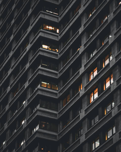 istock Low angle shot of a skyscraper building during the nighttime 1440549153