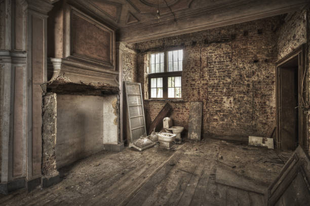 istock Abandoned room with dirty walls and broken doors - great for horror concepts 1440549505
