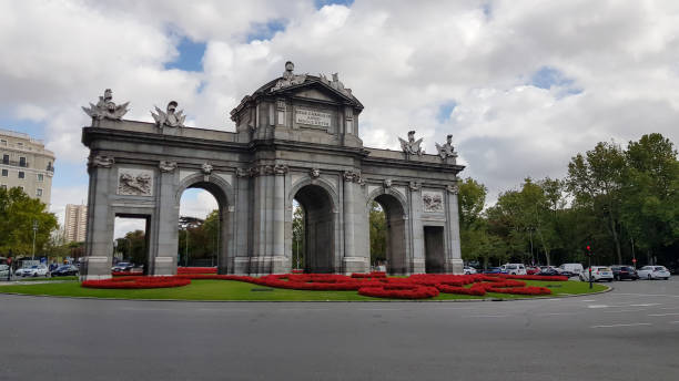 istock Puerta de Alcala Neo-classical gate in Madrid during day with traffic 1440549656