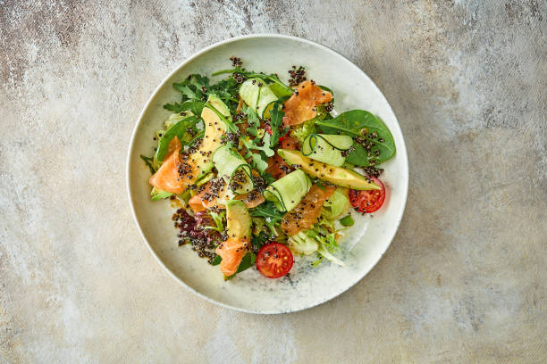 istock Salad with avocado and salmon in a plate. Close-up, selective focus 1440549735