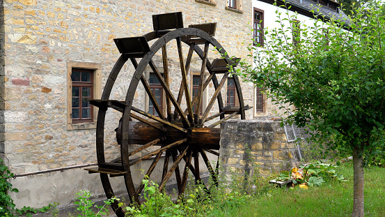A mill wheel in motion, old watermill of Bad Sobernheim, Germany