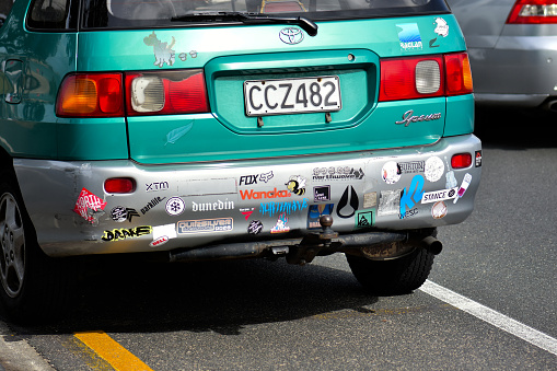 Auckland, New Zealand – December 25, 2020: View of local surfer's car with bumper stickers