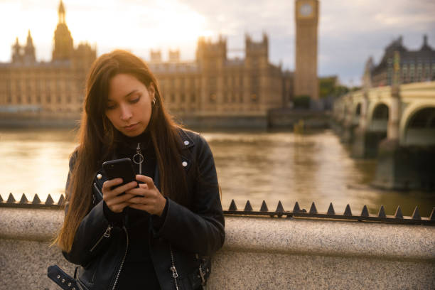 istock Woman using smartphone in London 1440549974