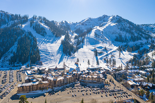 Olympic Valley, California, United States – December 07, 2020: Squaw Valley Ski Resort and Squaw Village, photographed from an aerial drone.