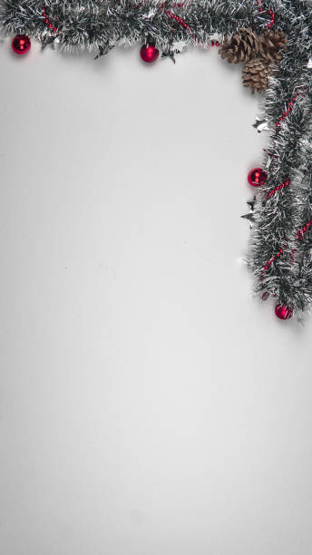 istock Vertical shot of beautiful Christmas decorations on white background with a copy space 1440550831