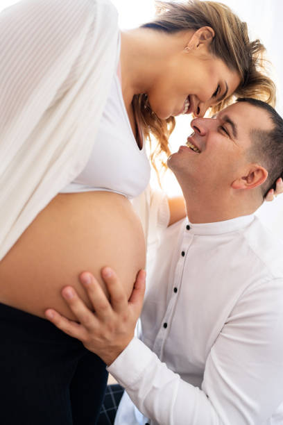 istock Pregnant couple in love 1440551053