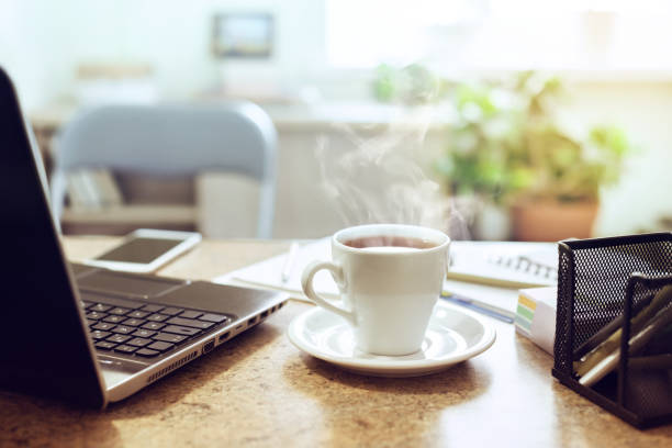 istock Close-upt  a cup of tea and financial documents 1440552689