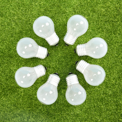 A vertical shot of led lamps on the grass texture