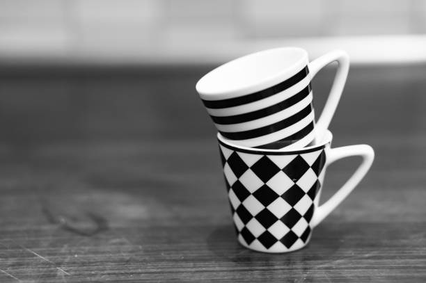 istock Grayscale shot of mugs with striped and chess tile patterns 1440553048