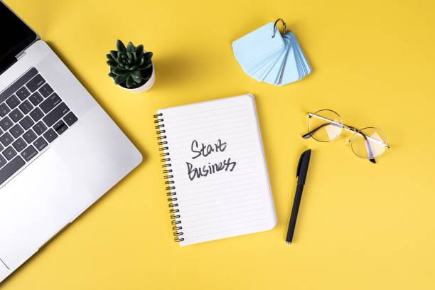 istock Top view of the working table with different office tools - planning a new business 1440553357