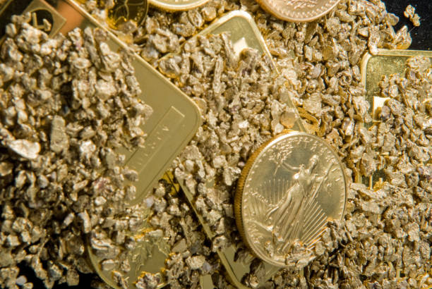 istock gold in coins, nuggets and ingots 1440553950