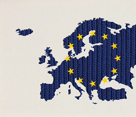 Creative conceptual design. Knitted texture of map of European Union over grey background. Current problems of gas importration. Concept of political support, creativity, social protection