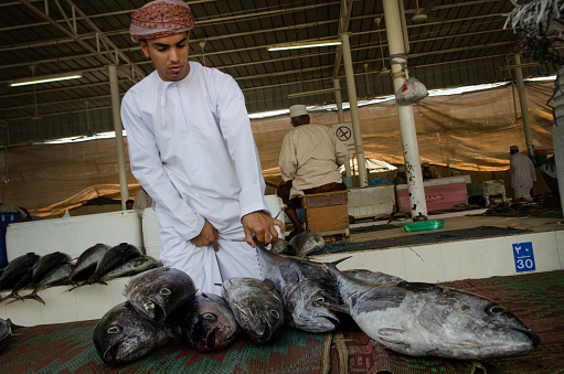 Muscat, Oman – May 26, 2014: Muscat, Oman. May 26th 2014\nBuying and selling inside Muscat Fish Market, Oman