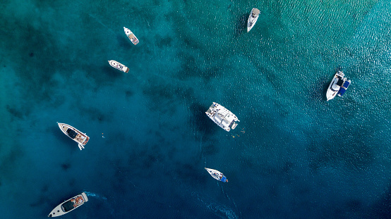 A big yacht with boats in the sea in summer in Greece