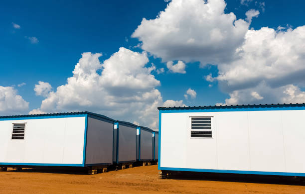 istock Modern caravans in a field under a blue cloudy sky and sunlight 1440557078