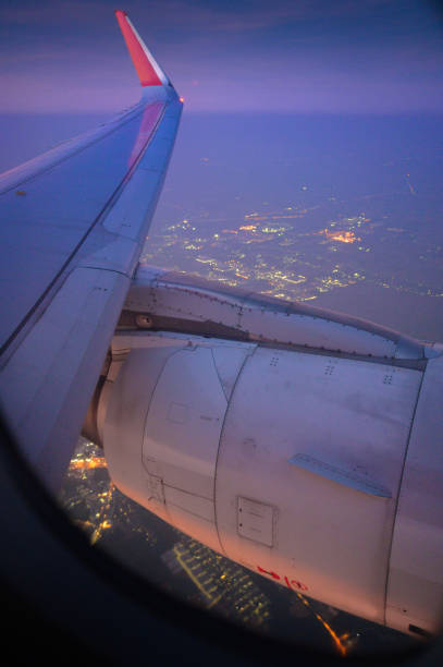 istock Air plane flying above sunset sky  nature background clouds with beautiful sunlight 1440558054