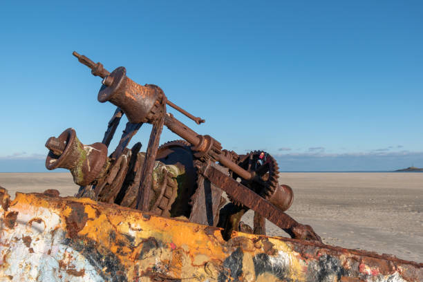 istock Selective focus shot of a shipwreck on a sandy beach in Norderney, Germany 1440559166