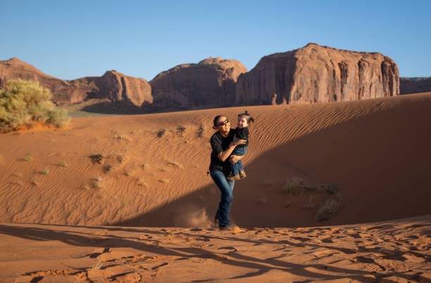 istock Mother with small kid in Monument Valley, USA 1440559199