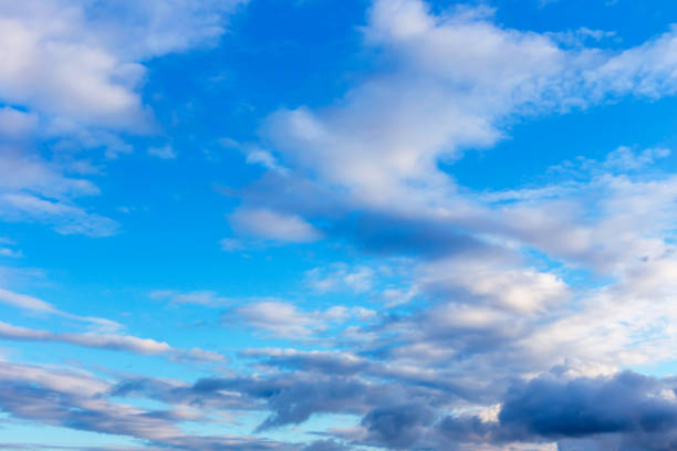 istock Dark and white fluffy clouds in the blue sky 1440559919