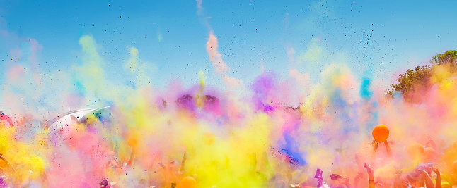 A vibrant shot of people celebrating Holi (Festival of colors) in South Africa