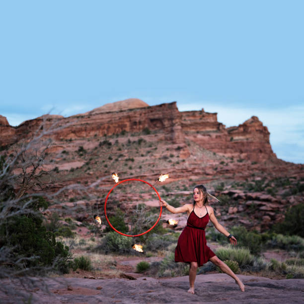 istock Dancer performing with a ring of fire at dusk in Moab Park, USA 1440560034