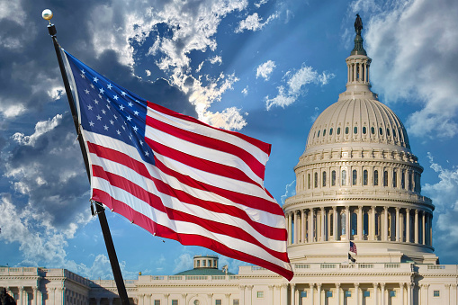 Biden Administration - Democratic Politics - U.S. Capitol and American Flag