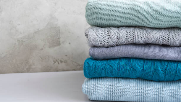 istock Stack of folded knitwear in blue and gray 1440560842