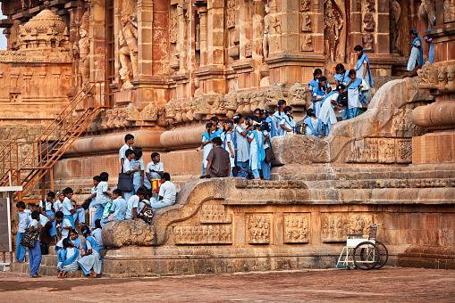 Tanjore, India - March 26, 2011: School children visiting famous Brihadishwarar Temple in Tanjore (Thanjavur), Tamil Nadu. It is the Greatest of Great Living Chola Temples - UNESCO World Heritage Site and importang religious and cultural site