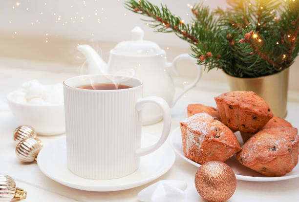 istock Winter, Christmas, New Year decorations composition, concept, background. White Mug, cup of tea, cookies. Christmas mood. Christmas greeting card. Mockup. 1440562540
