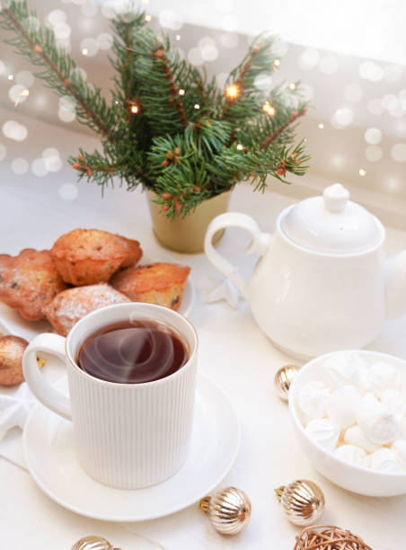 istock Winter, Christmas, New Year decorations composition, concept, background. White Mug, cup of tea, cookies. Christmas mood. Christmas greeting card. Mockup. 1440562549