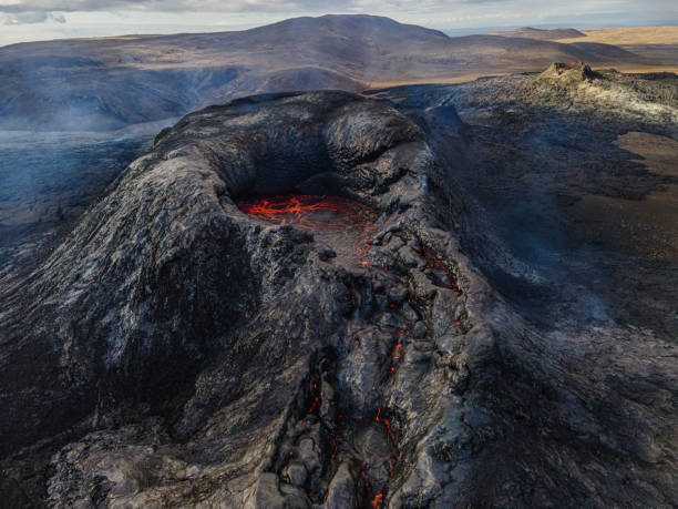 istock Volcanic crater after eruption with isolated lava flows 1440562691