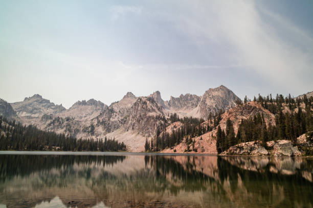 Alice Lake - Sawtooth Mountains - Idaho - Summer - Day - Wide Shot Alice Lake, a large alpine lake in Idaho’s Sawtooth Mountains seen on a summer day. The lake is within the Sawtooth Wilderness and Sawtooth National Forest and is a popular hiking destination. Sawtooth National Recreation Area stock pictures, royalty-free photos & images