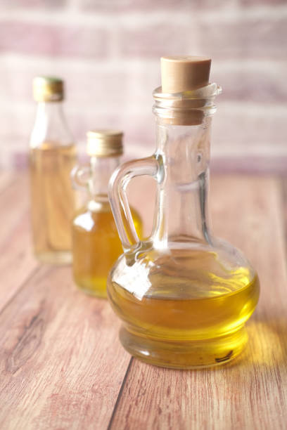 istock bottle of olive oil on table 1440563192