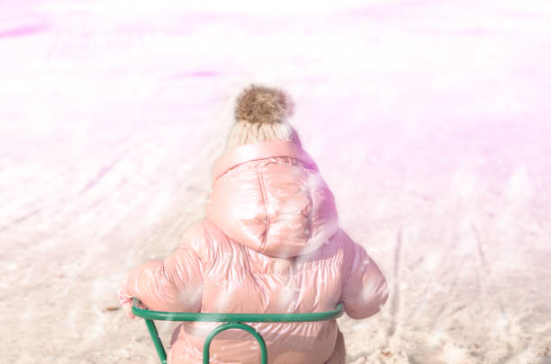 Joyful little girl plays with snow, joy, happiness, holiday