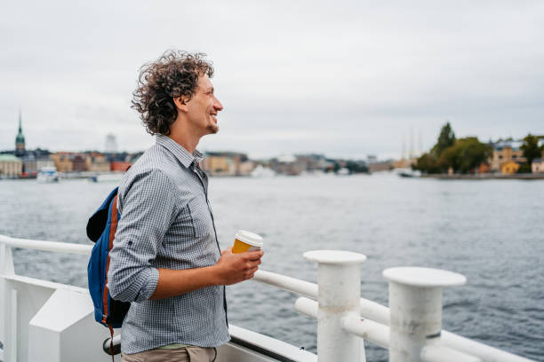 istock Young Man Drinking Coffee On The Boat In Stockholm 1440566200