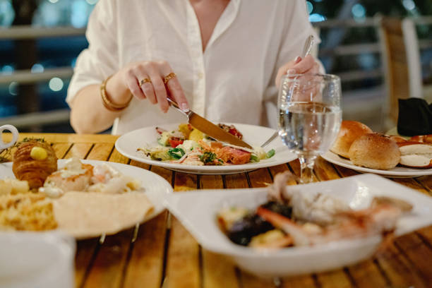 istock Woman eating dinner at the restaurant 1440566226