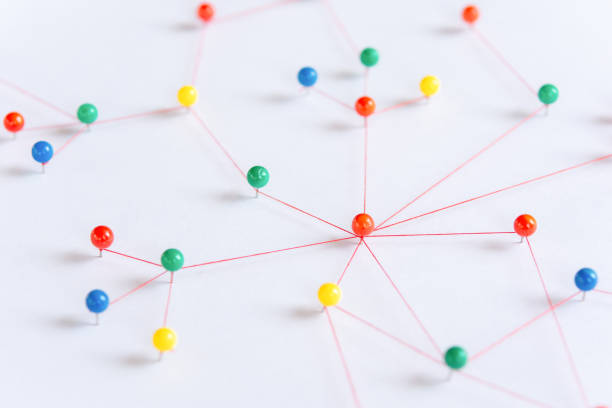 istock Linking entities, Blockchain, social media, Communications Network, The connection between the two networks. Network simulation on paper linked together by yarn 1440567969