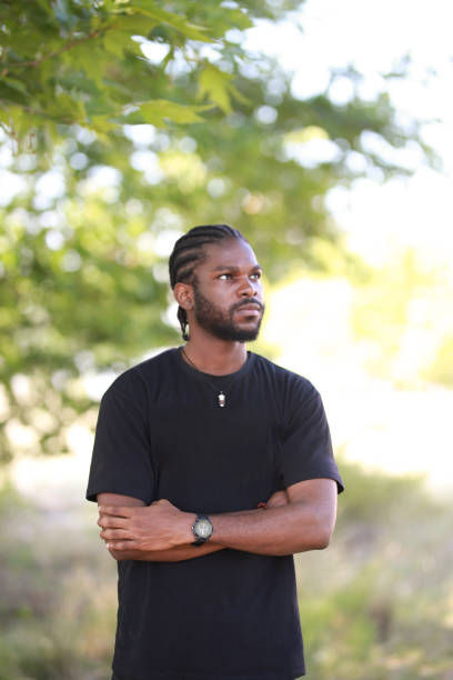 istock african american young man standing and crossed arms 1440568593