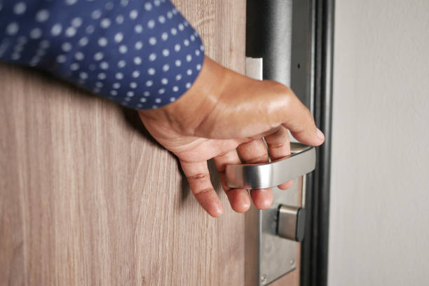 istock Man's Hand Opening door close up 1440568632