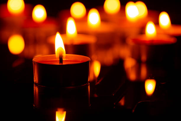 Macro candle,Candles Burning at Night. White Candles Burning in the Dark Macro candle,Candles Burning at Night. White Candles Burning in the Dark memorial vigil stock pictures, royalty-free photos & images