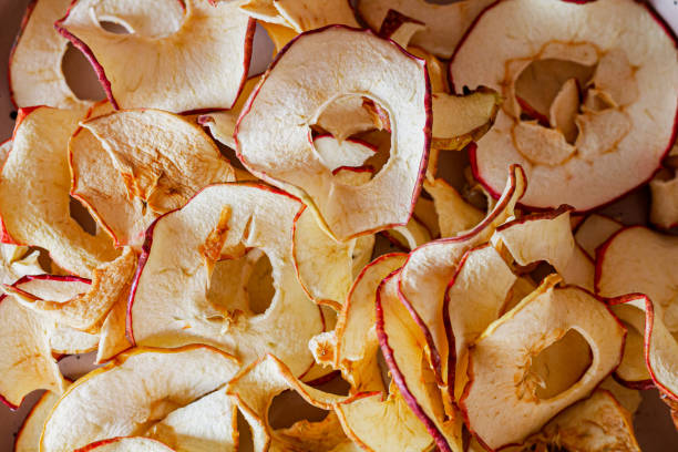 texture dry apple chips raw foodism - dried apple imagens e fotografias de stock