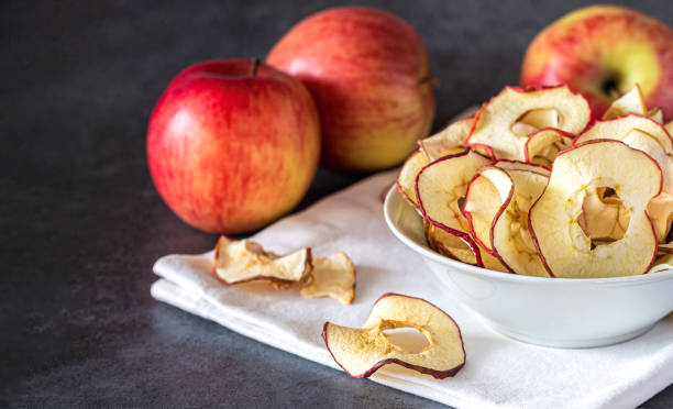 istock Dry organic apple slice chips in bowl 1440572780